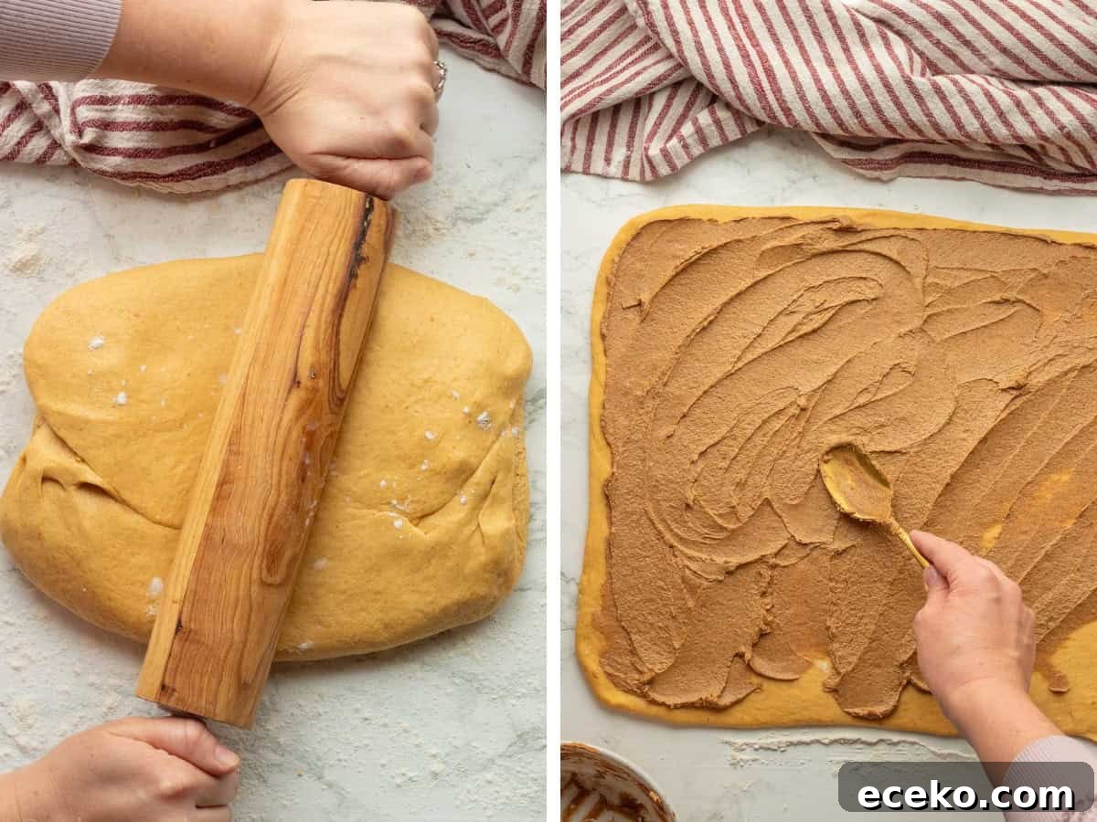 Rolling pin on pumpkin dough and spreading pumpkin filling on pumpkin dough.