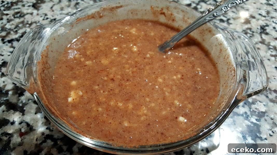 Creamy Shrimp Korma Recipe with Aromatic Spices 4 korma curry ingredients mixed together in a bowl with a spoon.