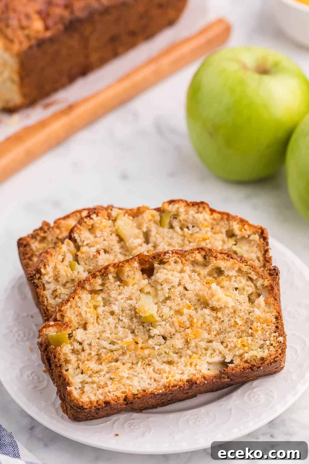Slices of apple cheddar bread on a white plate