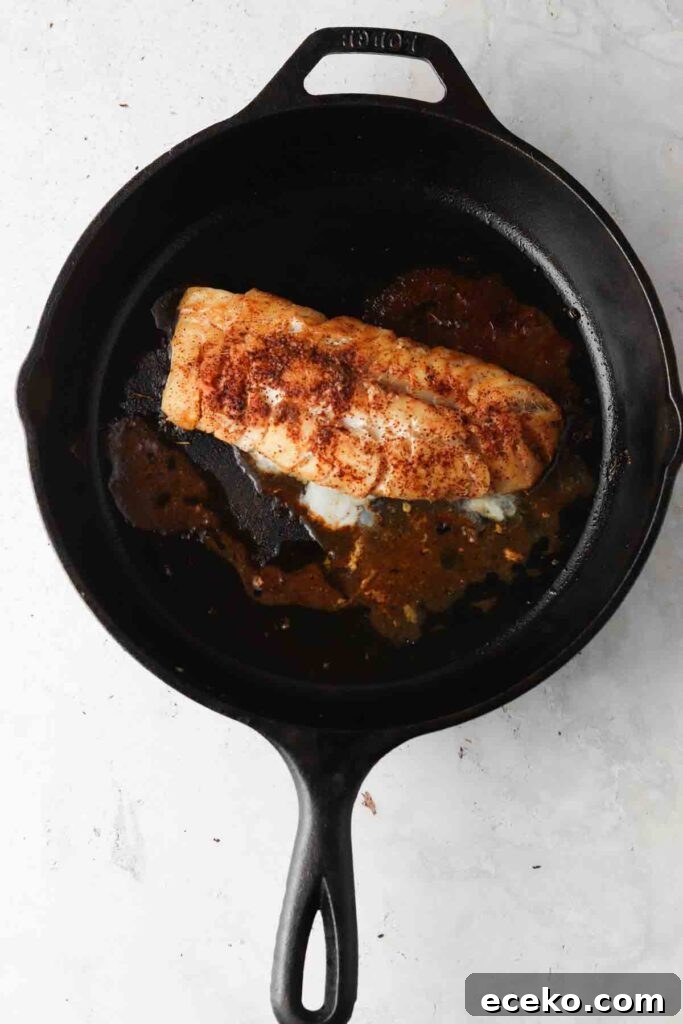 pan seared cod in a cast iron skillet