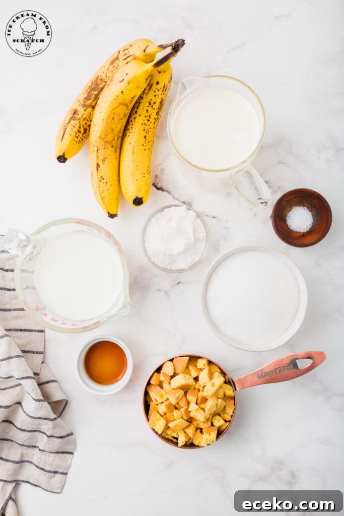 Creamy Banana Pudding Ice Cream Recipe for Summer 3 Ingredients needed for banana pudding ice cream on a marble countertop, all in separate bowls. Includes ripe bananas, chopped cookies, sugar, and cream.