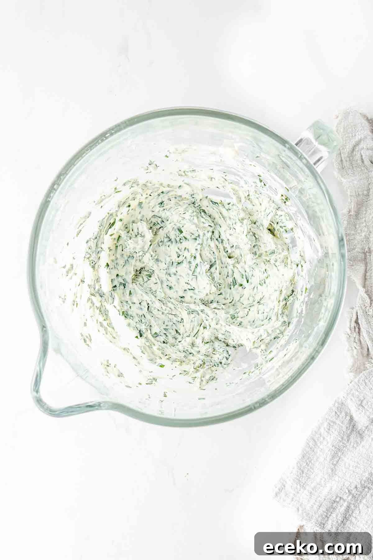 Smoked Salmon Crostini Recipe with Dill Cream Cheese & Capers 6 Whipped herbed cream cheese in a large glass mixing bowl.