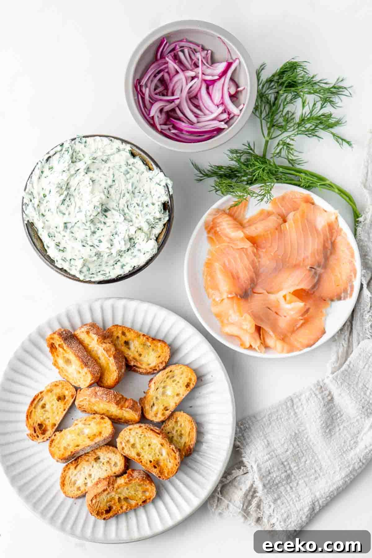 Smoked Salmon Crostini Recipe with Dill Cream Cheese & Capers 7 Ingredients for smoked salmon crostini ready to assemble.