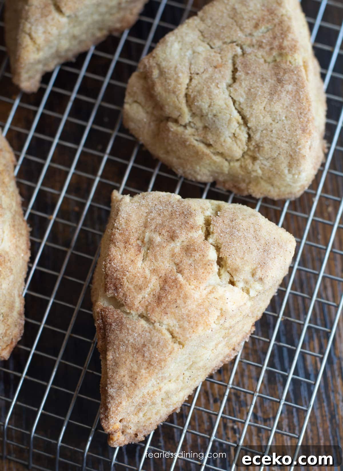 Snickerdoodle scones cooling on a wire rack.