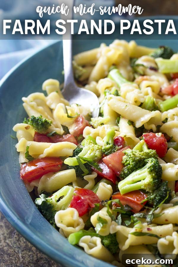 Pasta and vegetables in a blue serving bowl with text overlay - Farmstand Pasta.