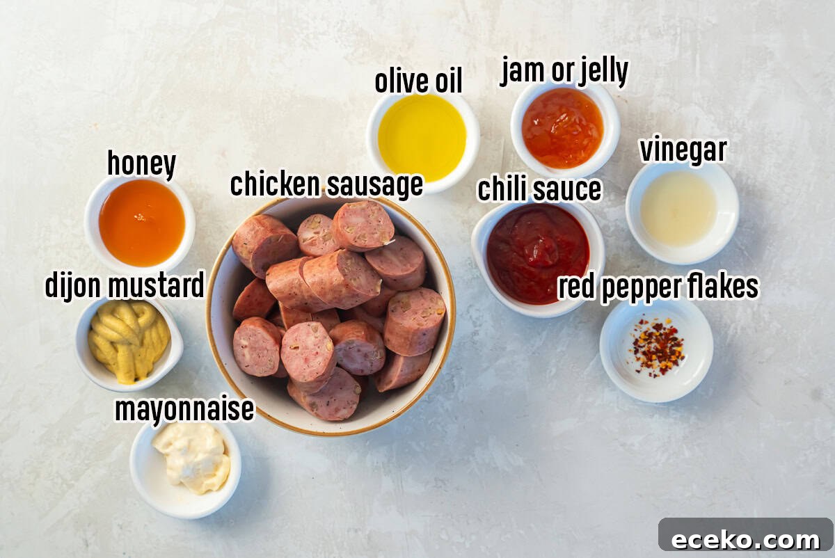 Savory Chicken Sausage Bites for Party Appetizers 3 Sliced chicken sausage surrounded by small bowls of ingredients including olive oil, Dijon mustard, mayonnaise, honey, chili sauce, jam, vinegar, and red pepper flakes on a light background.