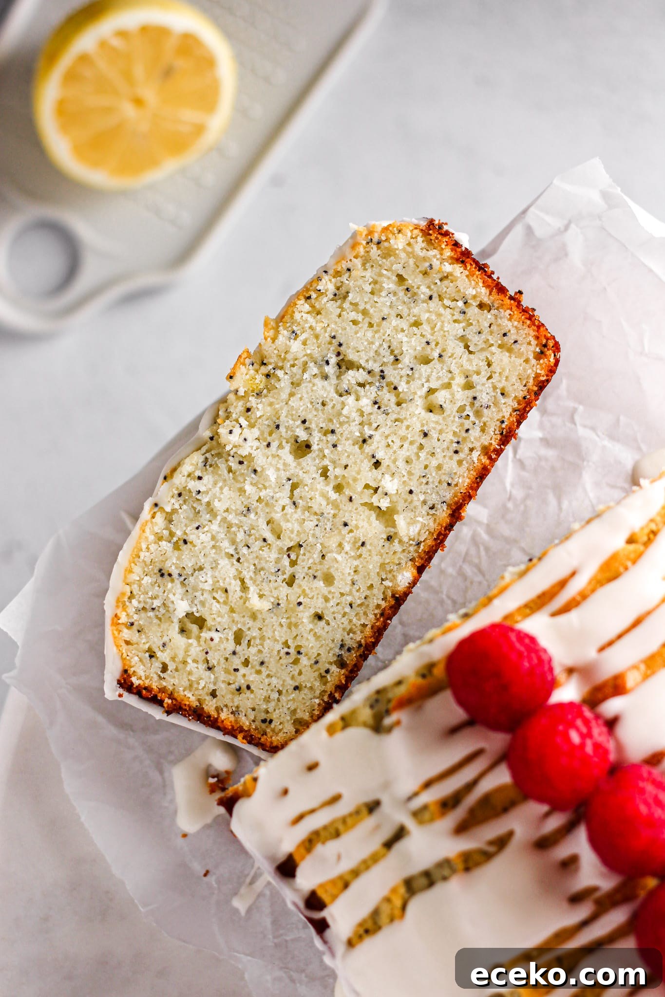 Moist Lemon Pound Cake with Zesty Lemon Glaze 3 slice of lemon poppy seed pound cake with raspberries for baking blog and food photography