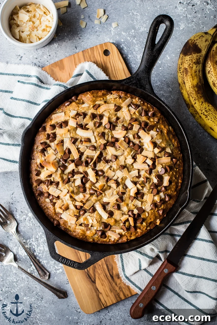 Skillet Banana Bread with Coconut and Chocolate Chips 2 Overhead photo of Coconut Chocolate Chip banana bread in a skillet