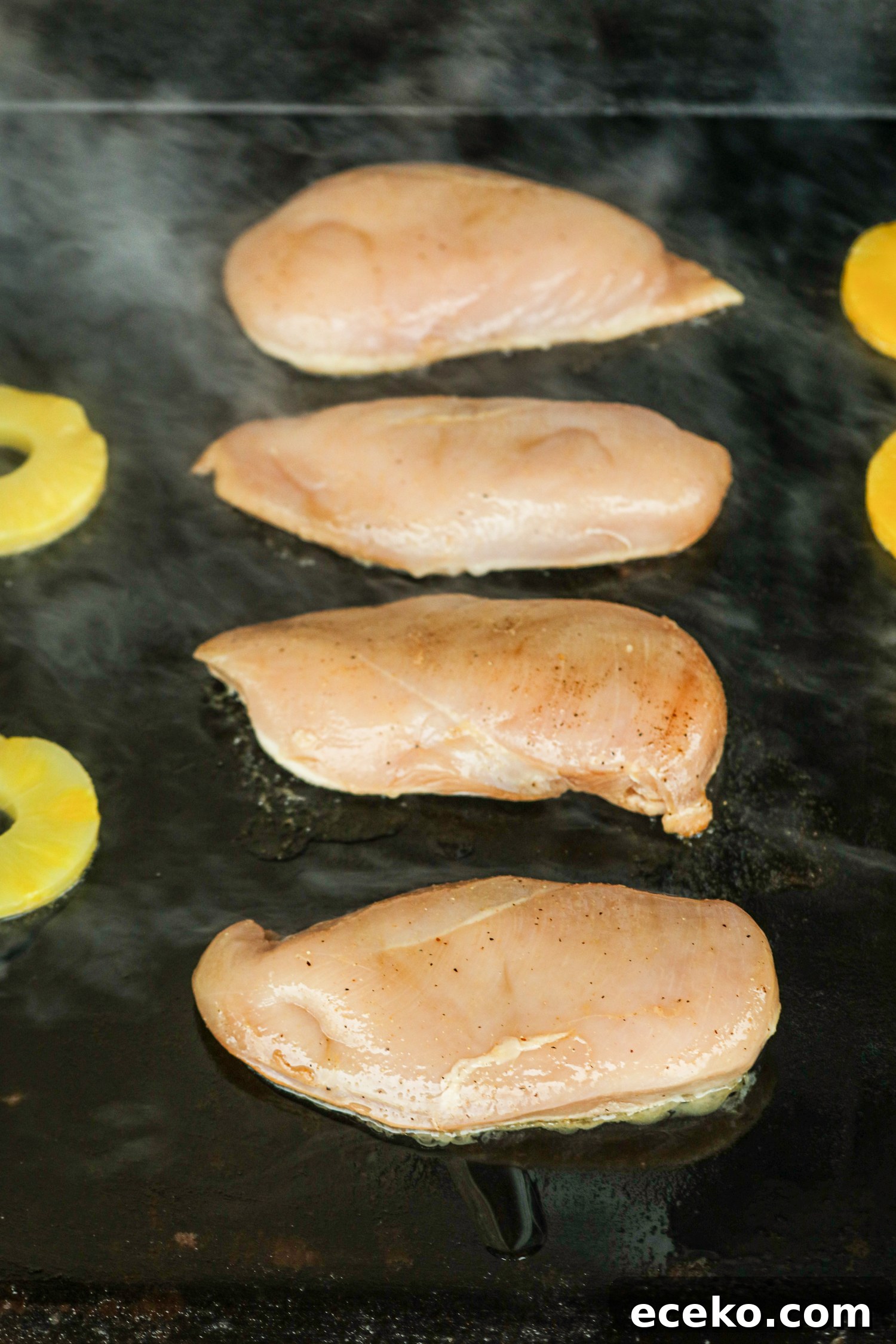 Sweet and Smoky Grilled Pineapple Chicken Recipe 5 Chicken on a hot griddle with pineapple slices