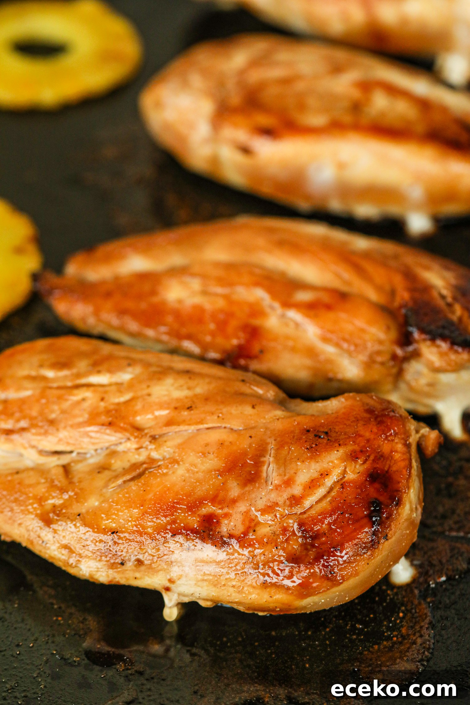Sweet and Smoky Grilled Pineapple Chicken Recipe 8 Close-up of grilled chicken breasts with juices and pineapple