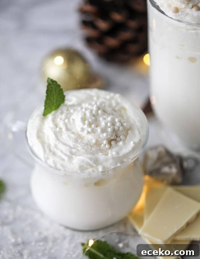 Creamy White Hot Chocolate with Fresh Mint 5 fresh mint white hot chocolate I howsweeteats.com #hotchocolate #christmas #holidays #whitechocolate