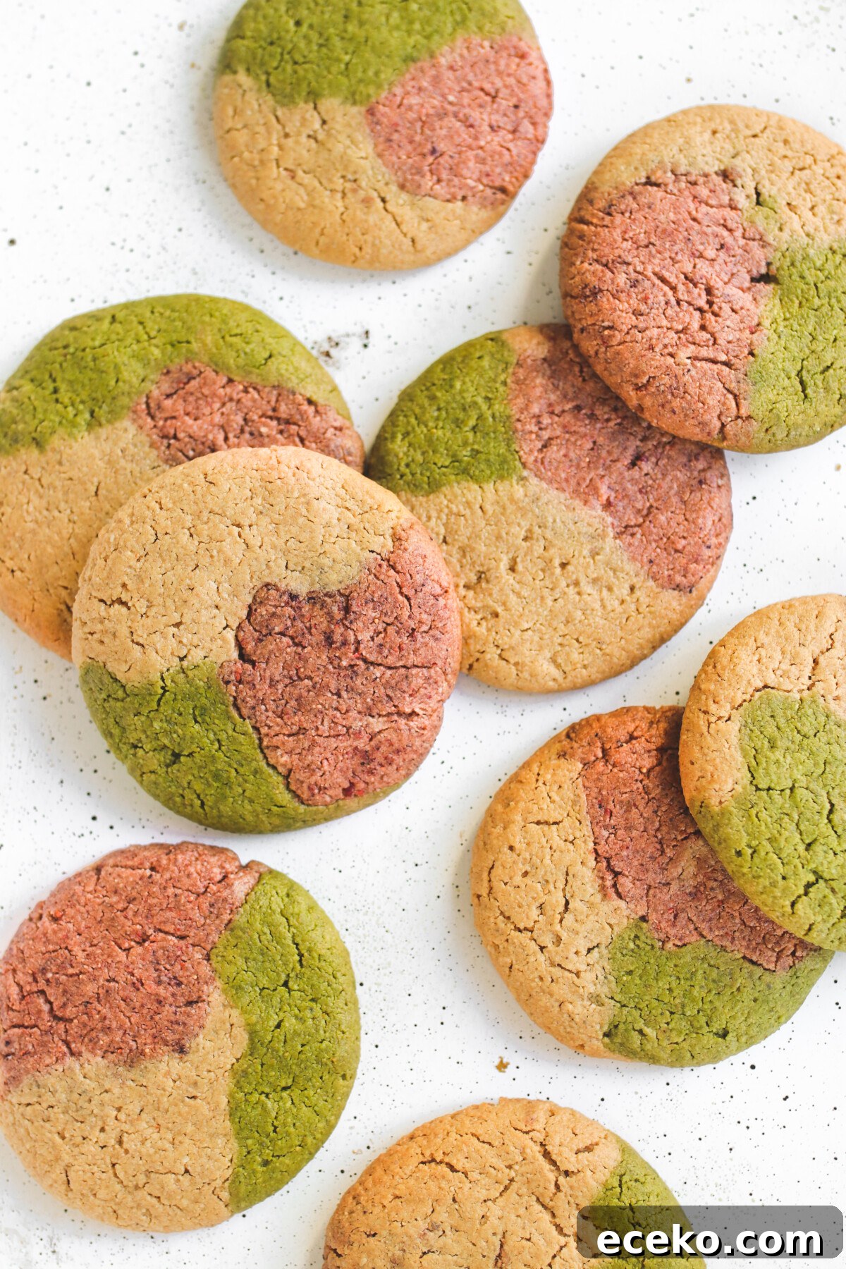 Gluten-Free Strawberry Matcha Sugar Cookie Recipe 2 nine gluten free sugar cookies with pink, green, and white.