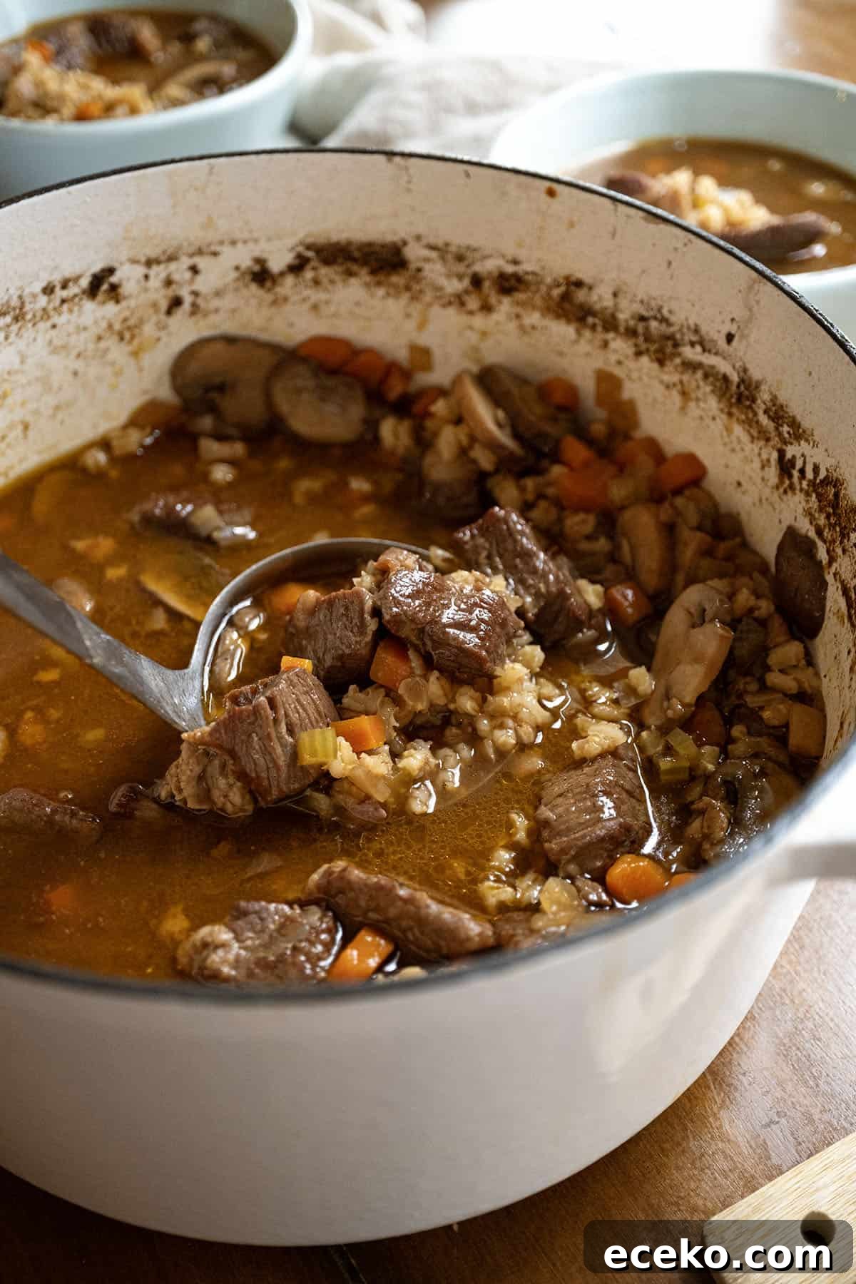 Hearty Beef, Barley and Mushroom Soup 2 Beef and barley soup in a pot.