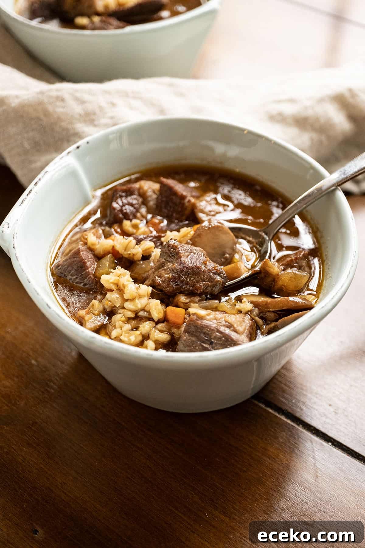 Hearty Beef, Barley and Mushroom Soup 10 Beef and barley soup in a bowl.