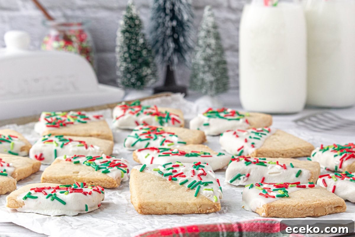 Hawaiian Shortbread Cookies with Coconut and Macadamia 14 A side-angle view of Hawaiian shortbread cookies with sprinkles and Christmas decor in the background.