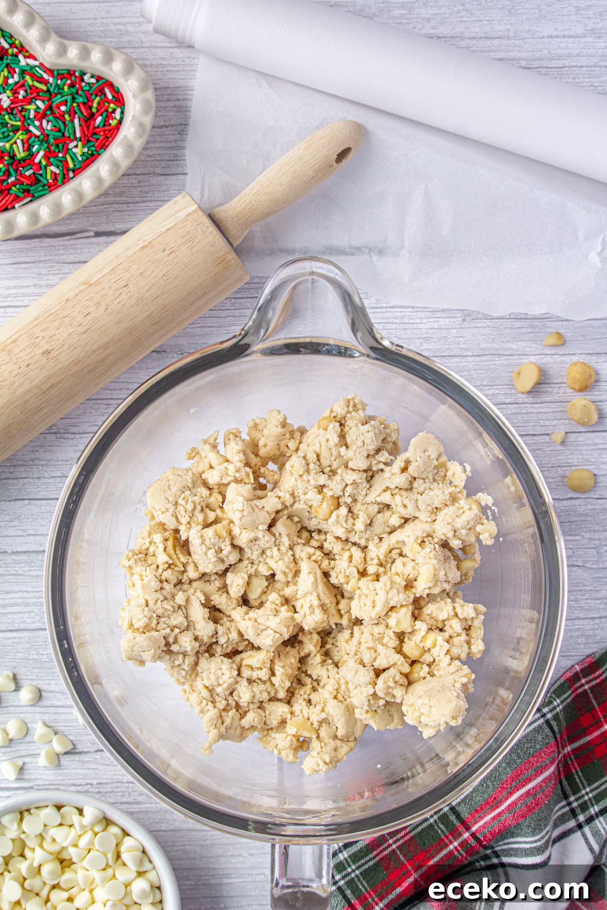 Hawaiian Shortbread Cookies with Coconut and Macadamia 4 Butter, sugar, and flour creamed together in a glass bowl.
