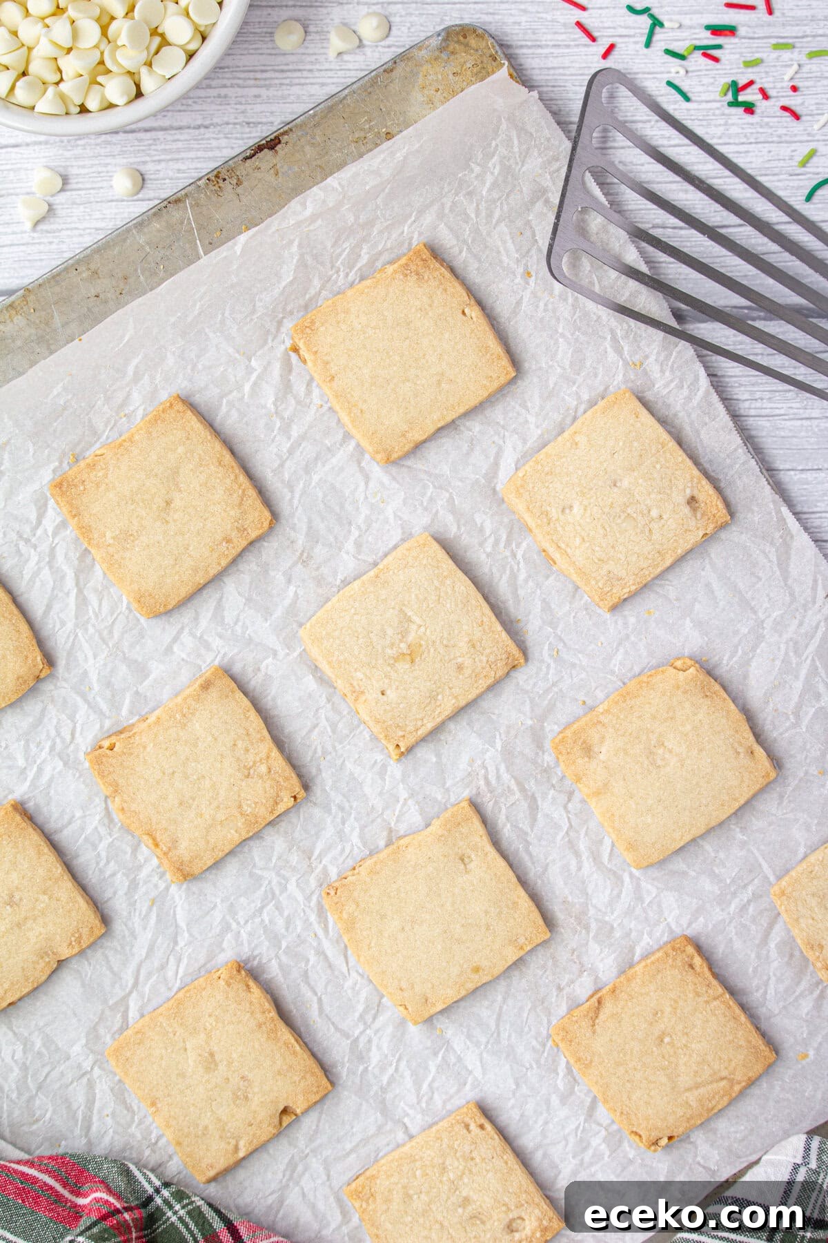 Hawaiian Shortbread Cookies with Coconut and Macadamia 6 Baked cookies on a baking sheet.