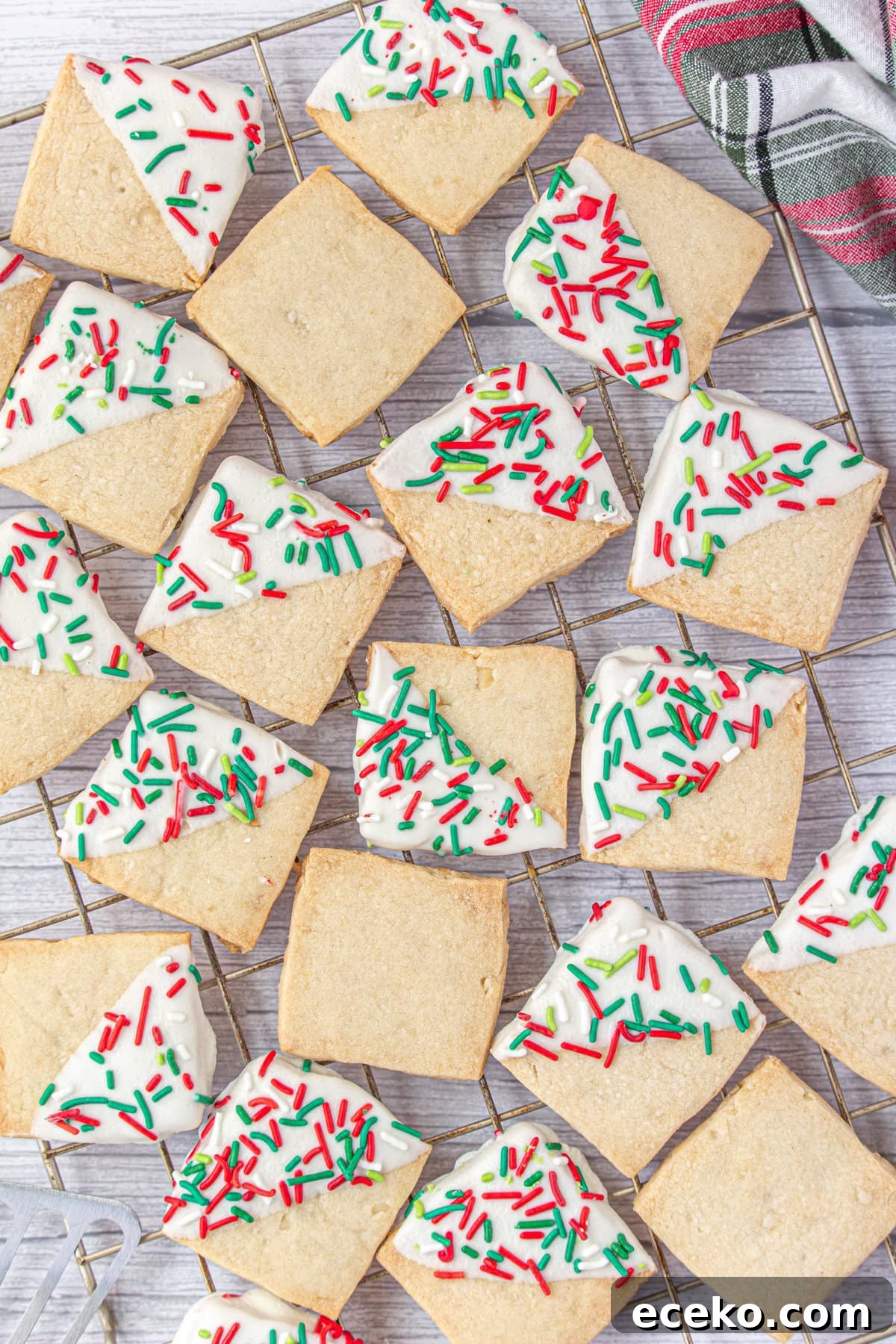 Hawaiian Shortbread Cookies with Coconut and Macadamia 8 Christmas Hawaiian shortbread cookies on a cooling rack.